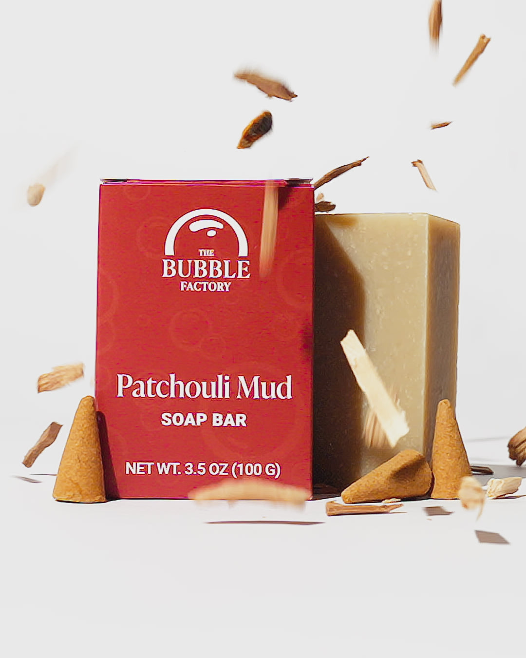 Patchouli Mud Natural Essential Oil Soap Bar, Front view Animation with Pieces of Woodstock